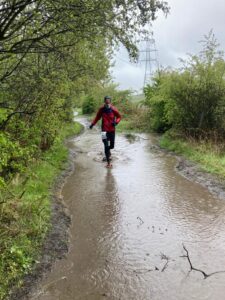 Dave running through a massive puddle