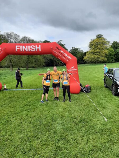 Three Steel City Striders by the finish line