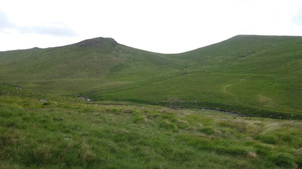 Seemingly tiny runners approaching the daunting final climb