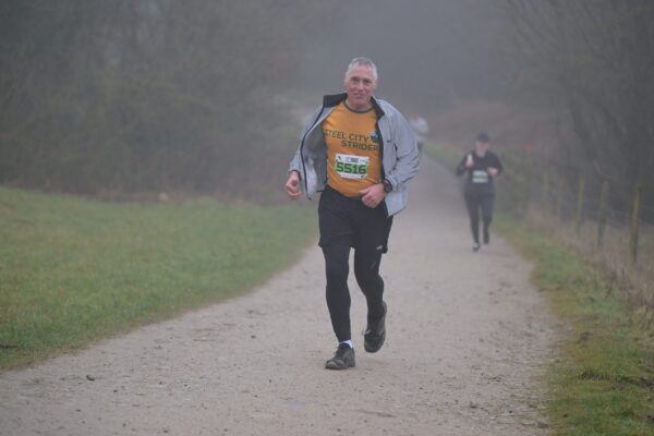 Clive Downing running in rainy conditions 