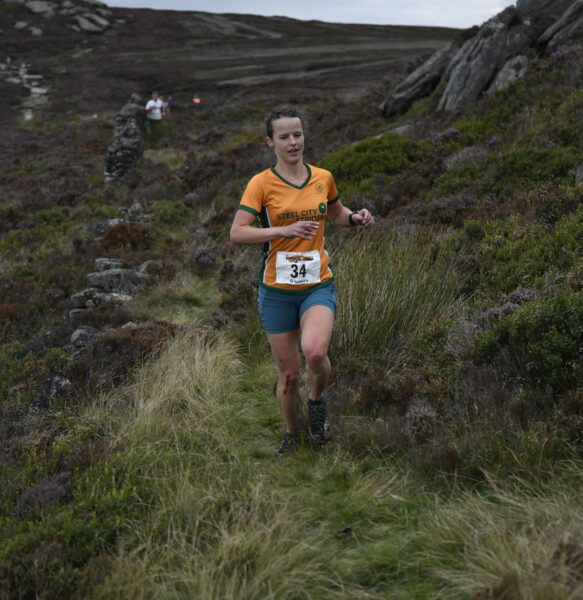Harriet Davies running toward the camera