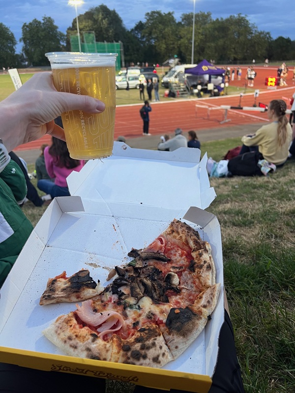 Pizza and beer after the Tracksmith Twilight 5000